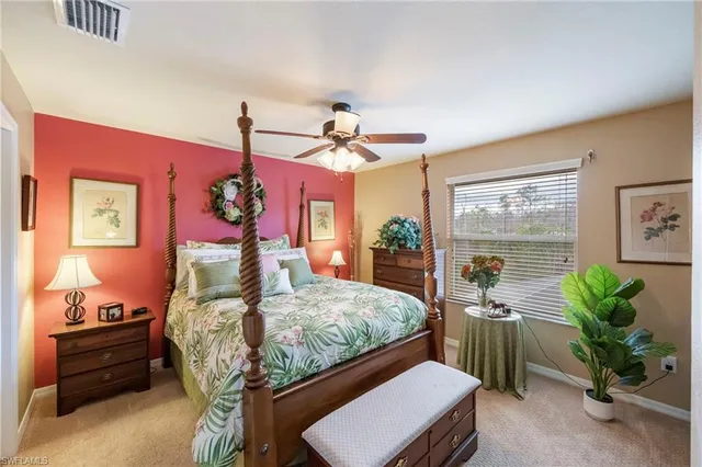 a bed room with furniture and a chandelier