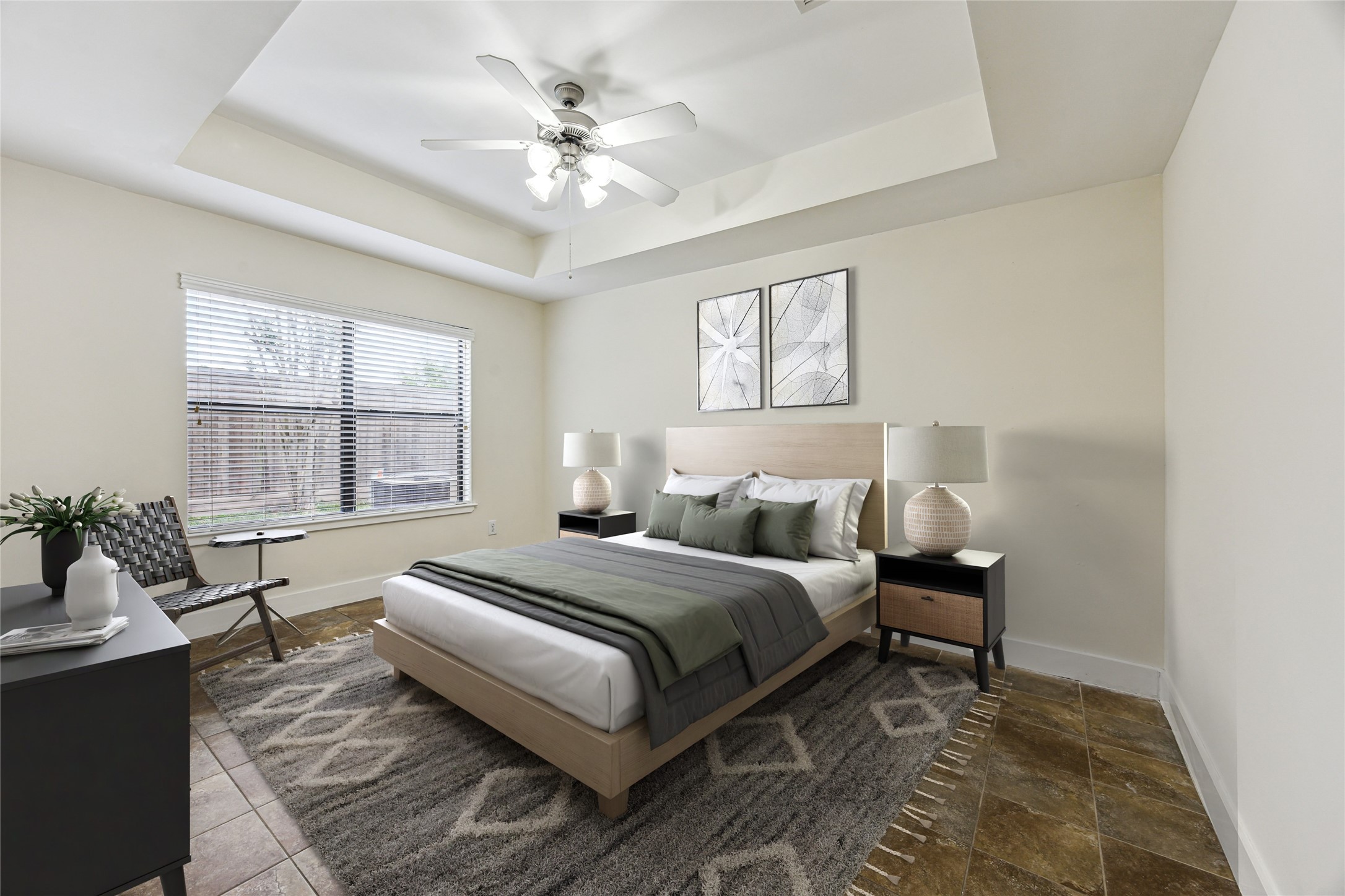 9829 Riddlelink Lane Houston, TX 77025 - Photo 14 of 22 **Virtually Staged** Light-filled downstairs bedroom with neutral tones, tile flooring, and tray ceiling, make this a perfect space for your guests.