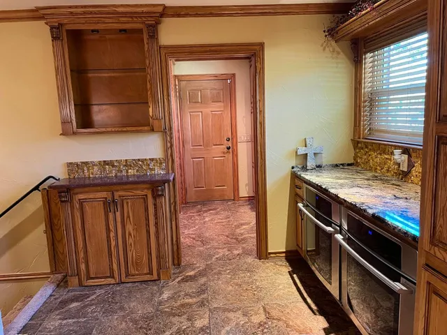 a view of a storage & utility room with a washer dryer