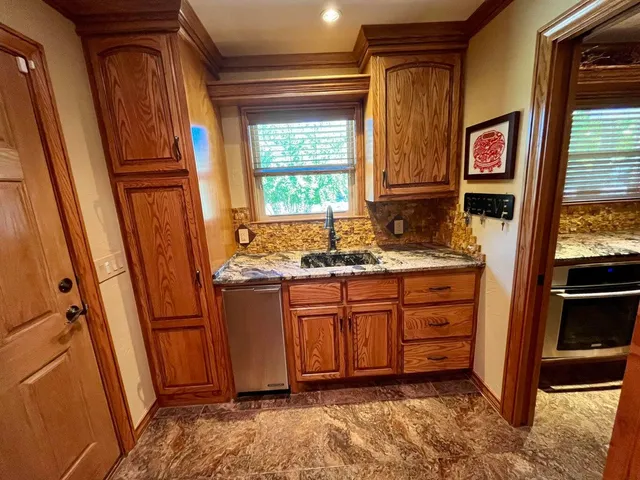 a room with cabinets and piano table