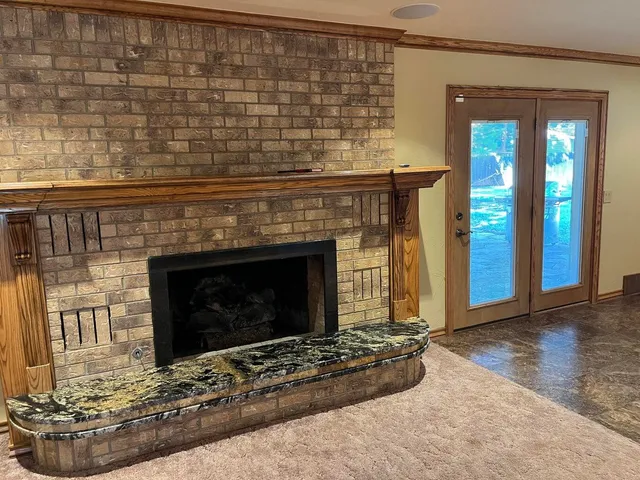 a living room with fireplace