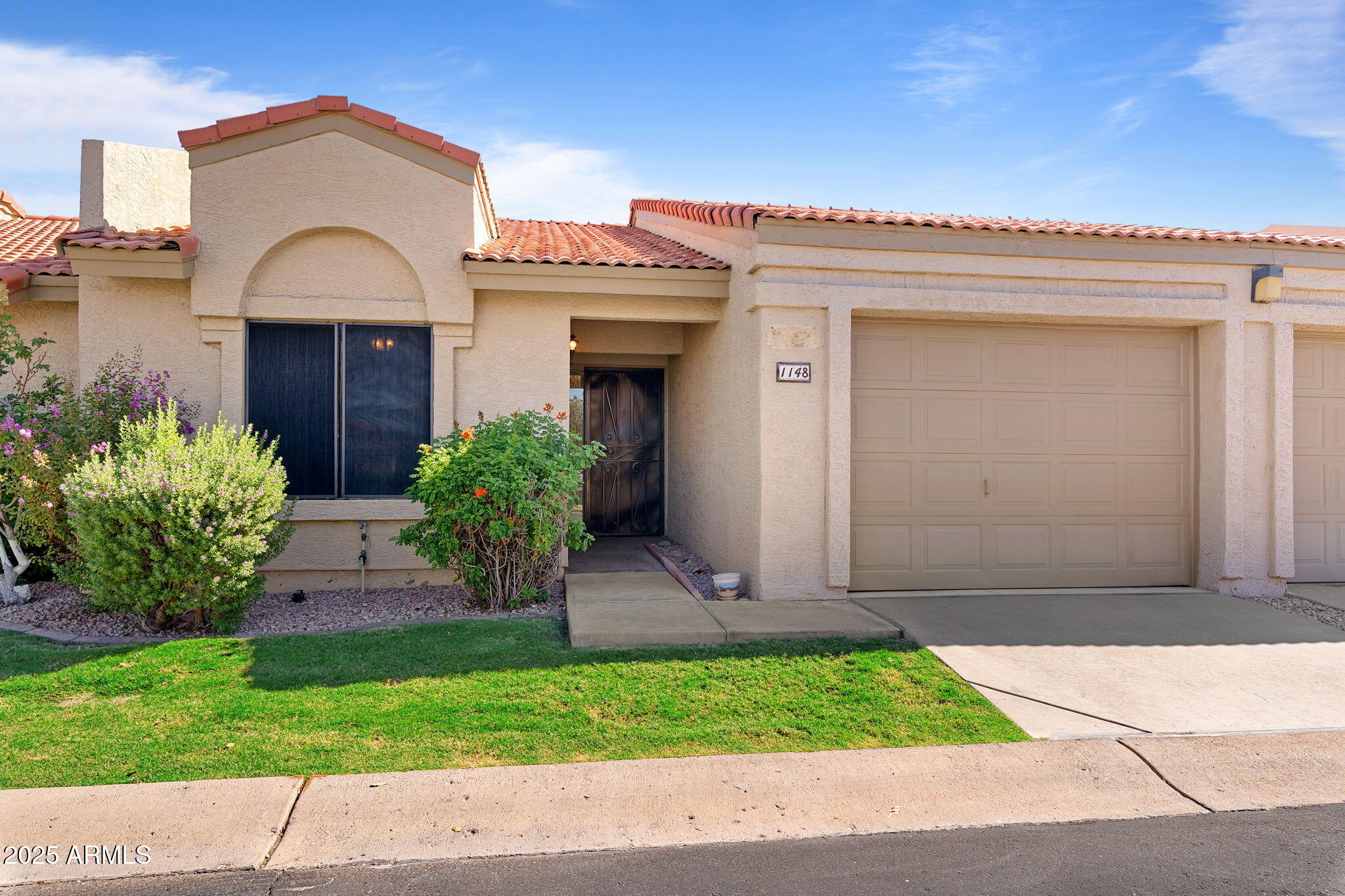 1021 South Greenfield Road, Unit 1148 Mesa, AZ 85206 - Photo 1 of 14 a view of entrance gate of a house