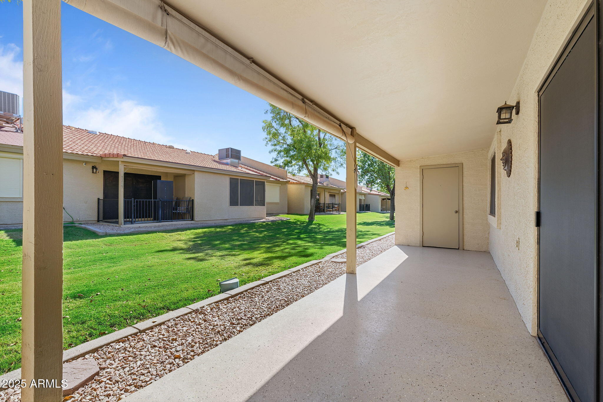 1021 South Greenfield Road, Unit 1148 Mesa, AZ 85206 - Photo 14 of 14 a view of a house with a yard and pathway
