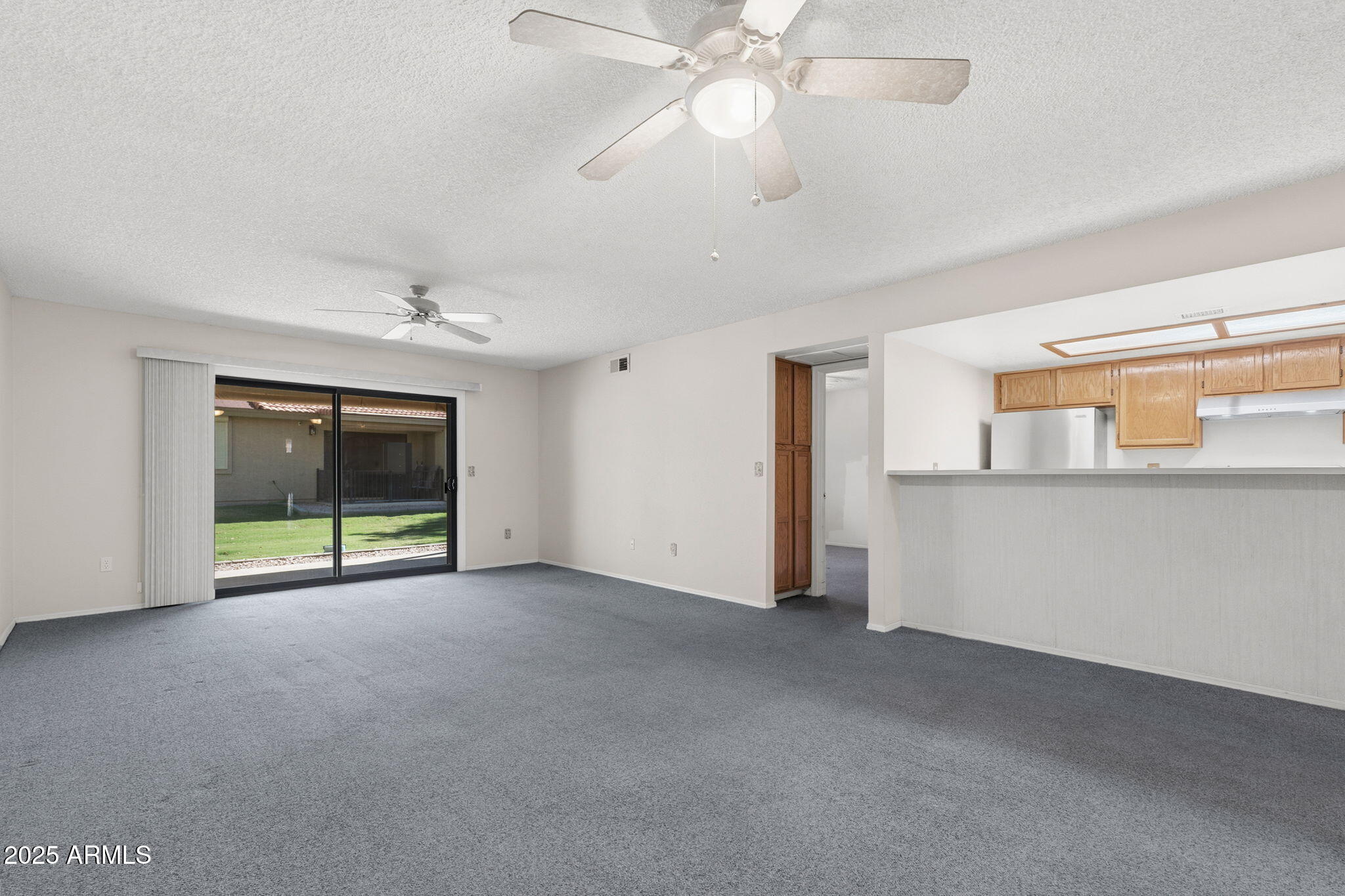 1021 South Greenfield Road, Unit 1148 Mesa, AZ 85206 - Photo 4 of 14 a view of an empty room with a window
