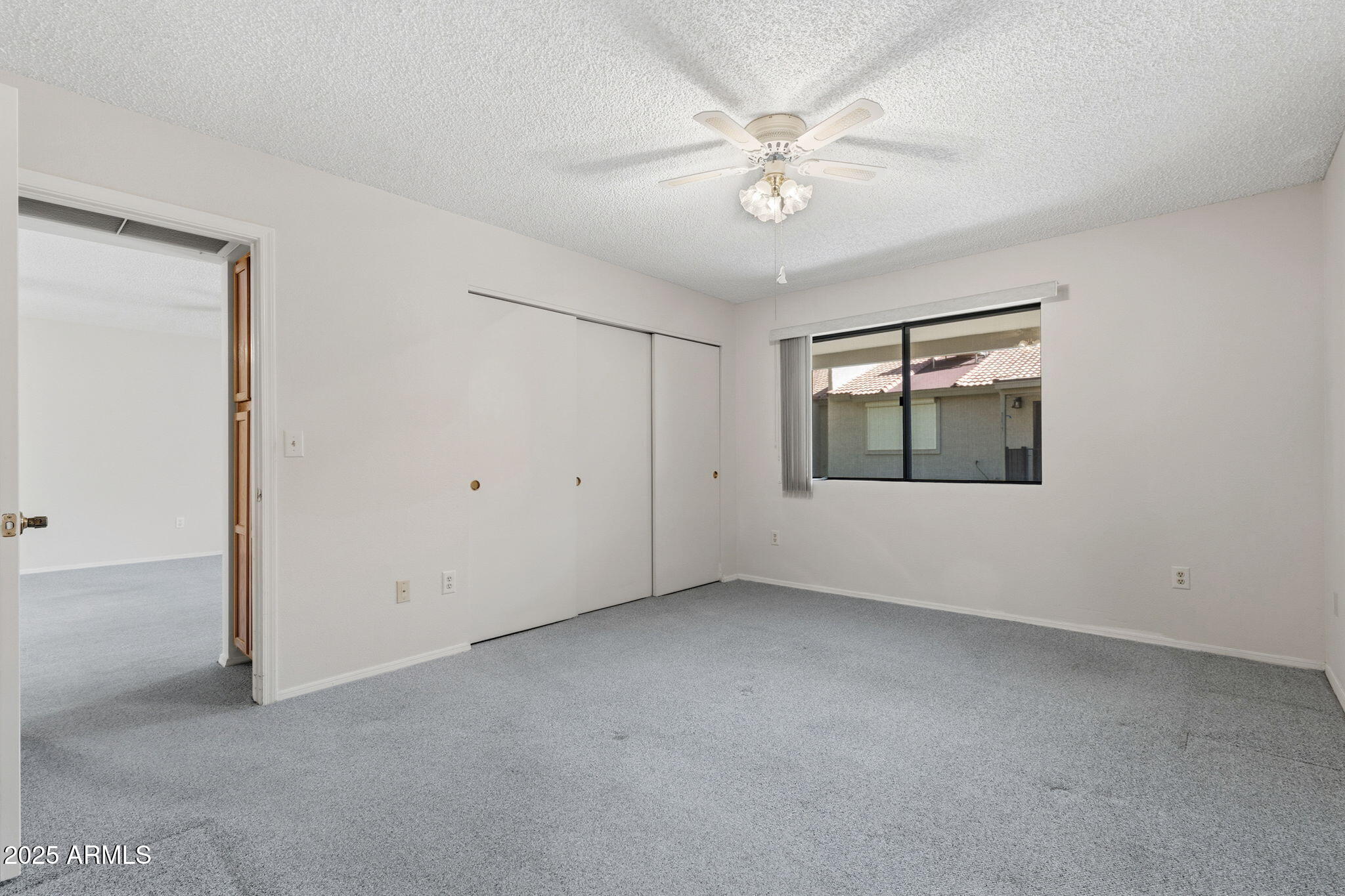 1021 South Greenfield Road, Unit 1148 Mesa, AZ 85206 - Photo 9 of 14 an empty room with a view of a room