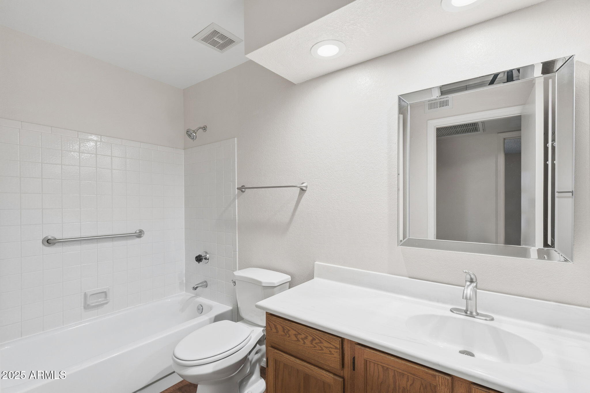 1021 South Greenfield Road, Unit 1148 Mesa, AZ 85206 - Photo 10 of 14 a bathroom with a sink a toilet and shower