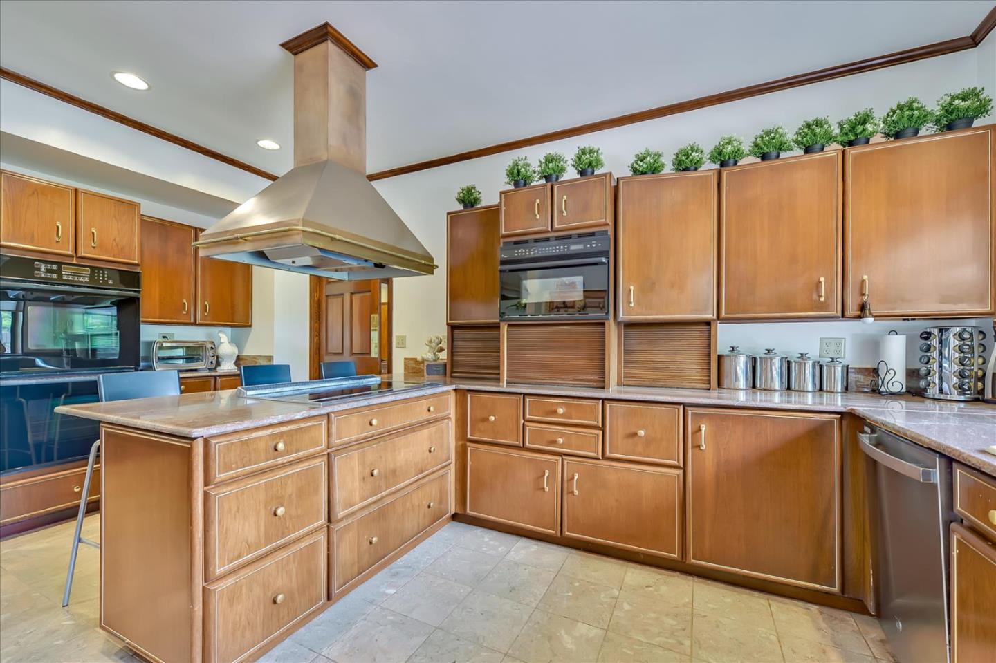 35 Echo Lane Woodside, CA 94062 - Photo 13 of 54 a kitchen with a sink window and cabinets