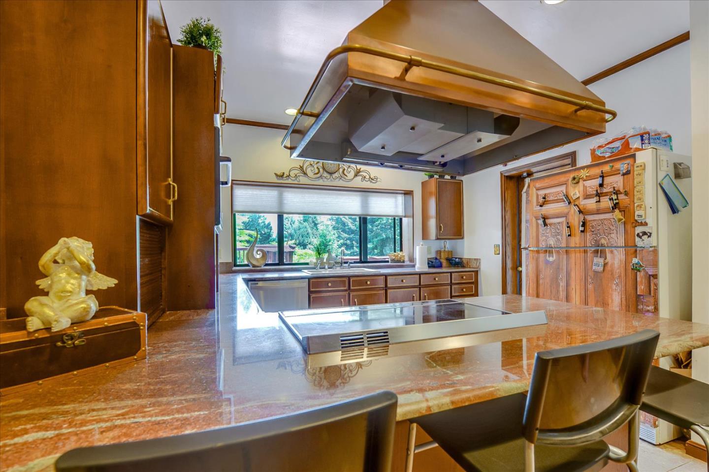 35 Echo Lane Woodside, CA 94062 - Photo 14 of 54 a view of a dining room with furniture a chandelier and wooden floor
