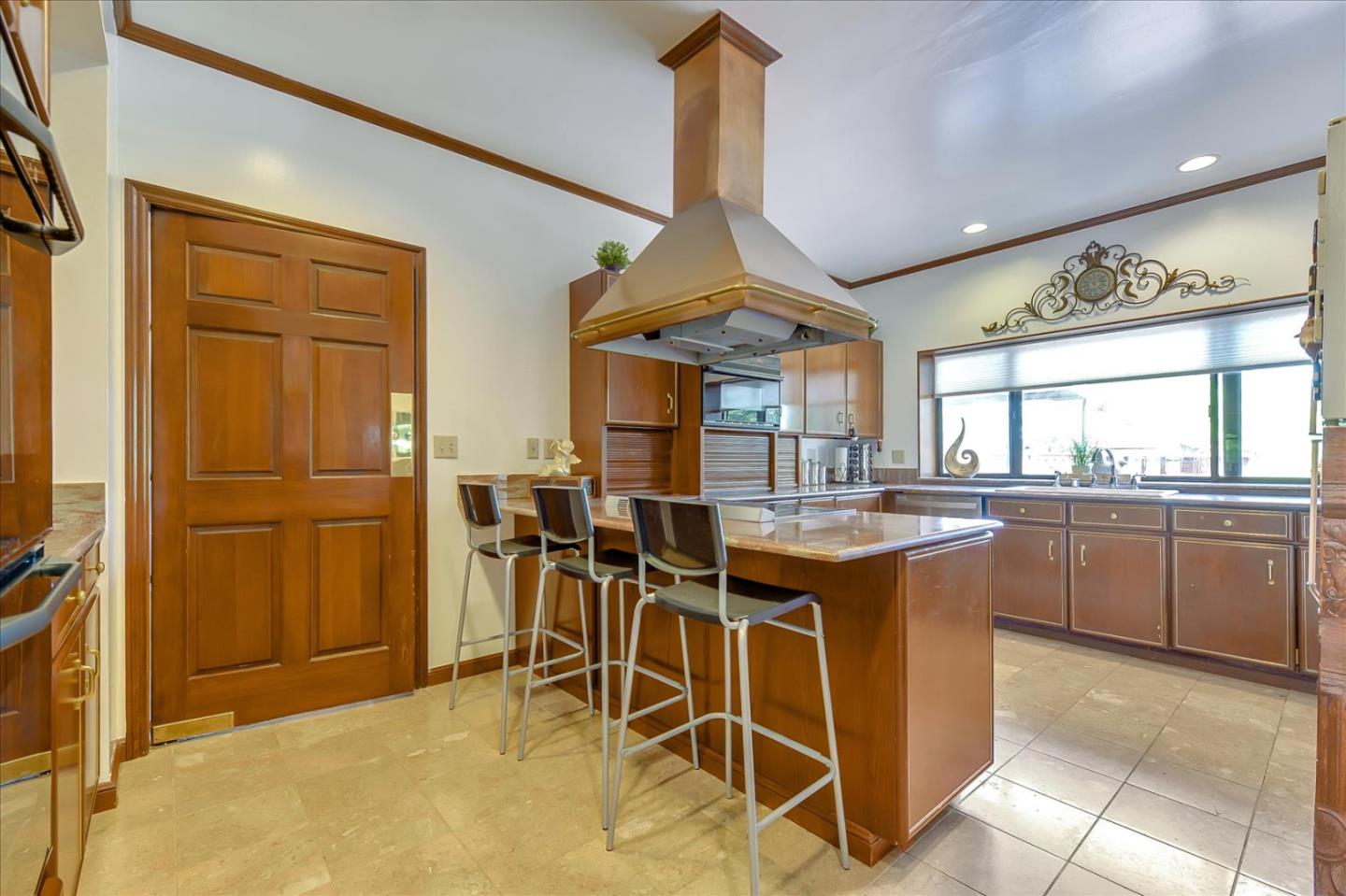35 Echo Lane Woodside, CA 94062 - Photo 15 of 54 a kitchen with stainless steel appliances granite countertop a stove a sink dishwasher and a refrigerator