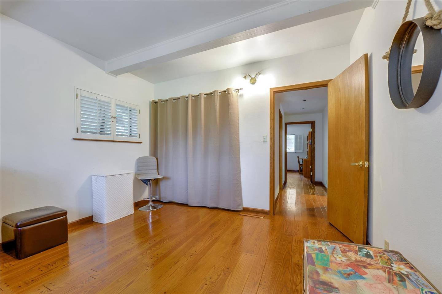 35 Echo Lane Woodside, CA 94062 - Photo 17 of 54 a view of a hallway with wooden floor and furniture