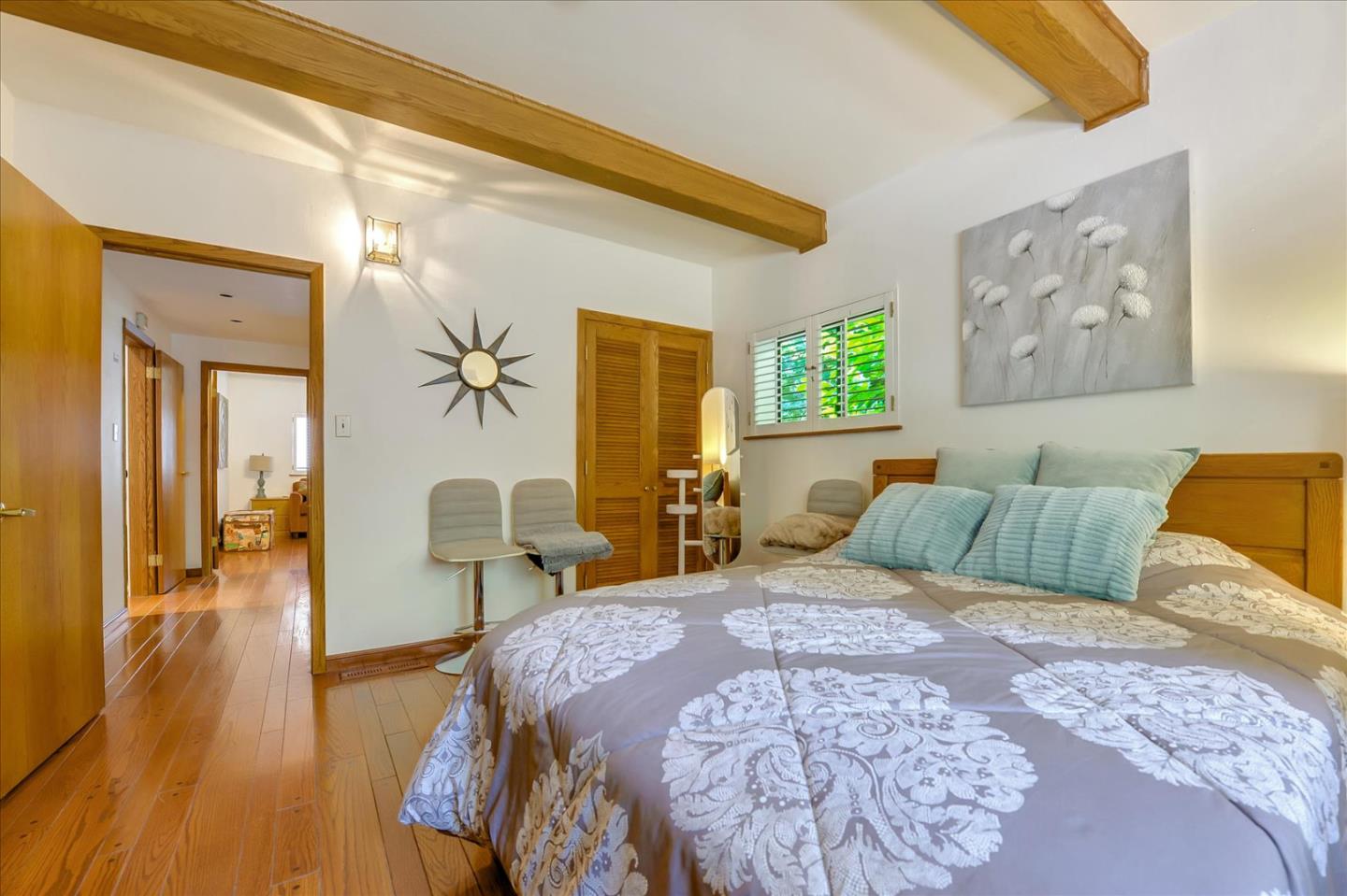 35 Echo Lane Woodside, CA 94062 - Photo 20 of 54 a bedroom with a large bed couch and a window