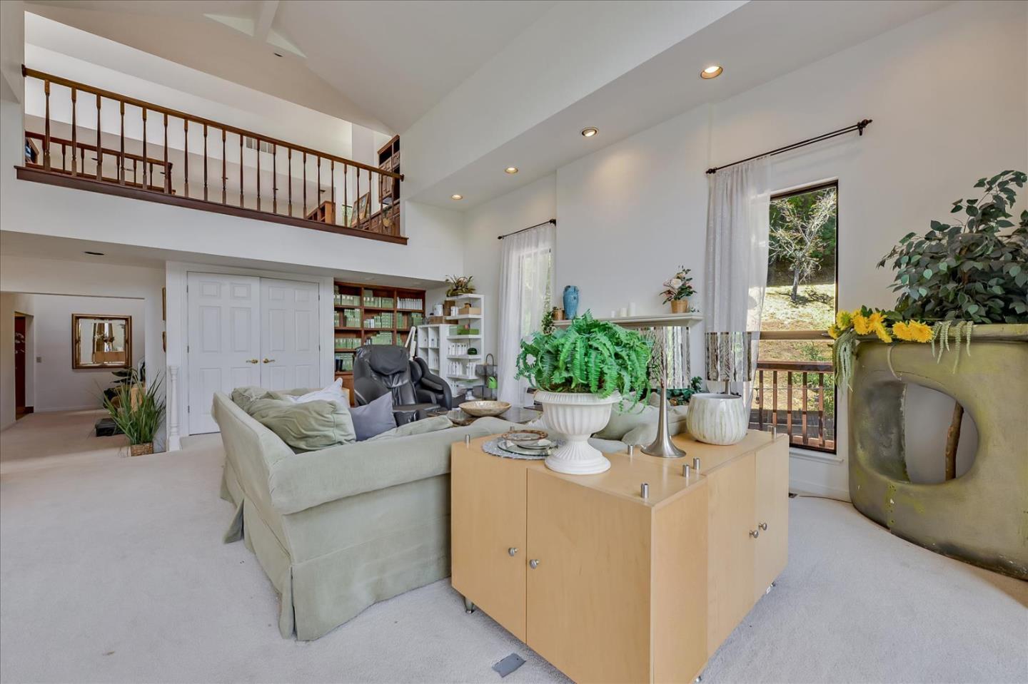 35 Echo Lane Woodside, CA 94062 - Photo 22 of 54 a living room with furniture a fireplace and a potted plant