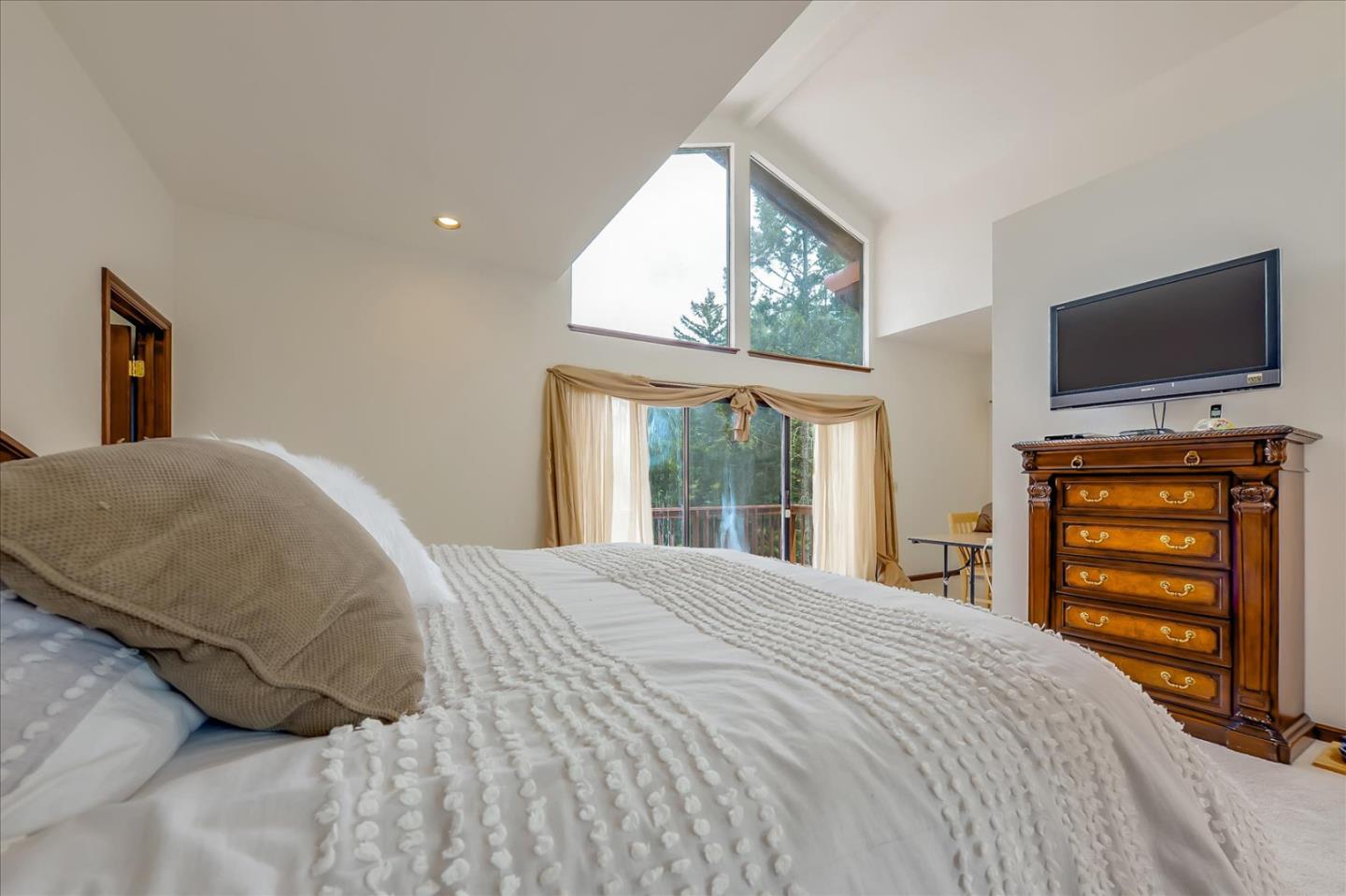 35 Echo Lane Woodside, CA 94062 - Photo 30 of 54 a bedroom with a bed and a flat screen tv