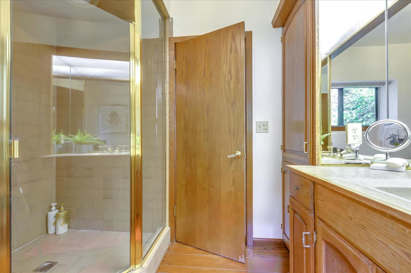 35 Echo Lane Woodside, CA 94062 - Photo 38 of 54 a bathroom with a granite countertop sink and a mirror