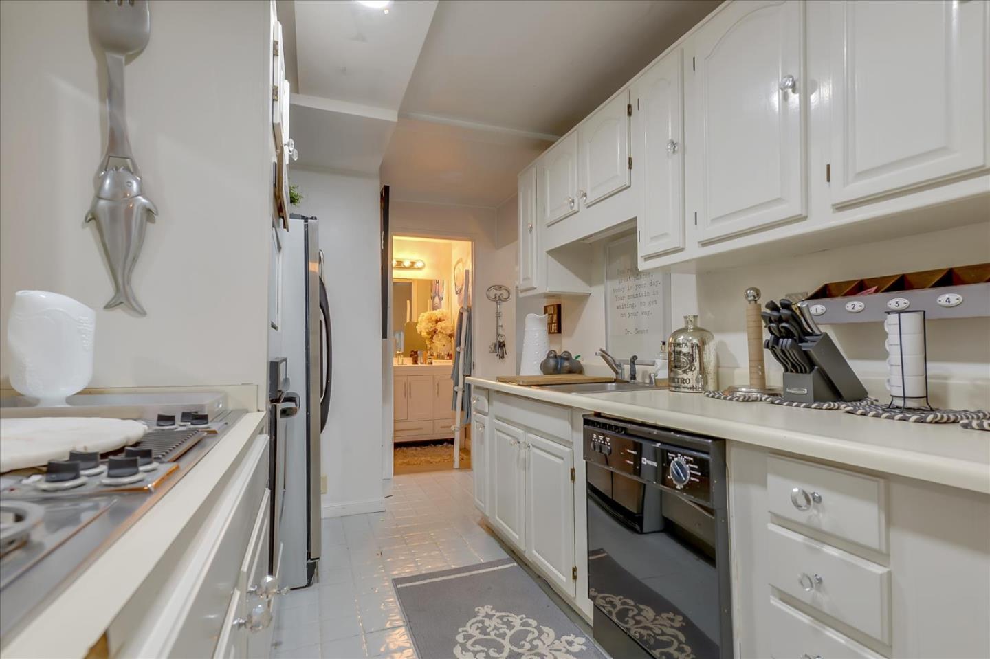 35 Echo Lane Woodside, CA 94062 - Photo 40 of 54 a kitchen with a sink stove and refrigerator