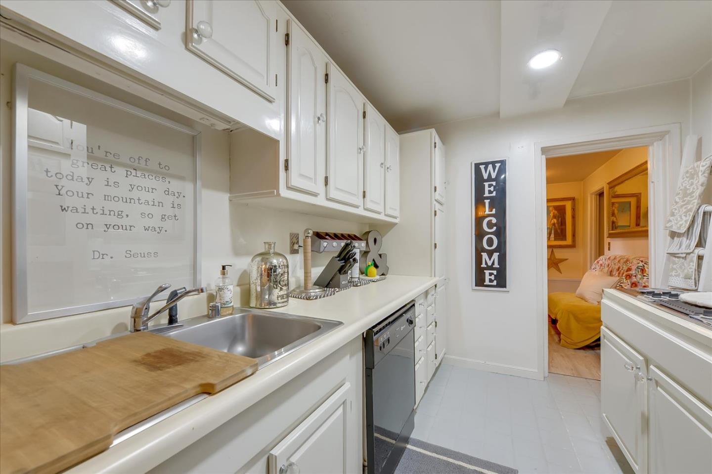 35 Echo Lane Woodside, CA 94062 - Photo 41 of 54 a kitchen with a sink stove and cabinets