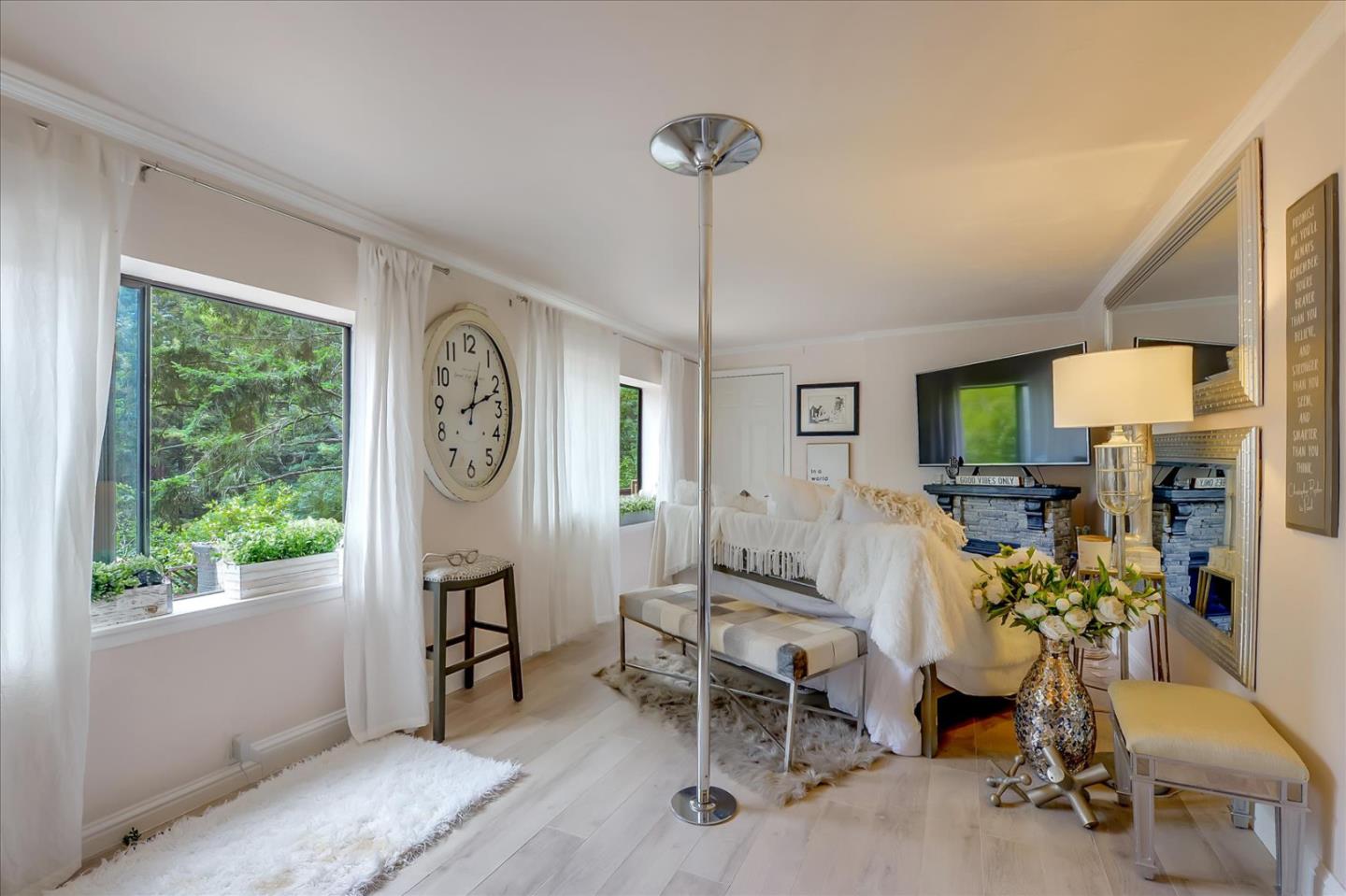 35 Echo Lane Woodside, CA 94062 - Photo 42 of 54 a living room with furniture a window and a flat screen tv