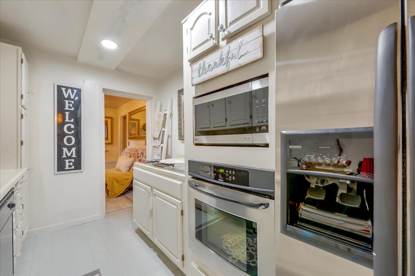 35 Echo Lane Woodside, CA 94062 - Photo 46 of 54 a kitchen with stainless steel appliances granite countertop a stove and a microwave