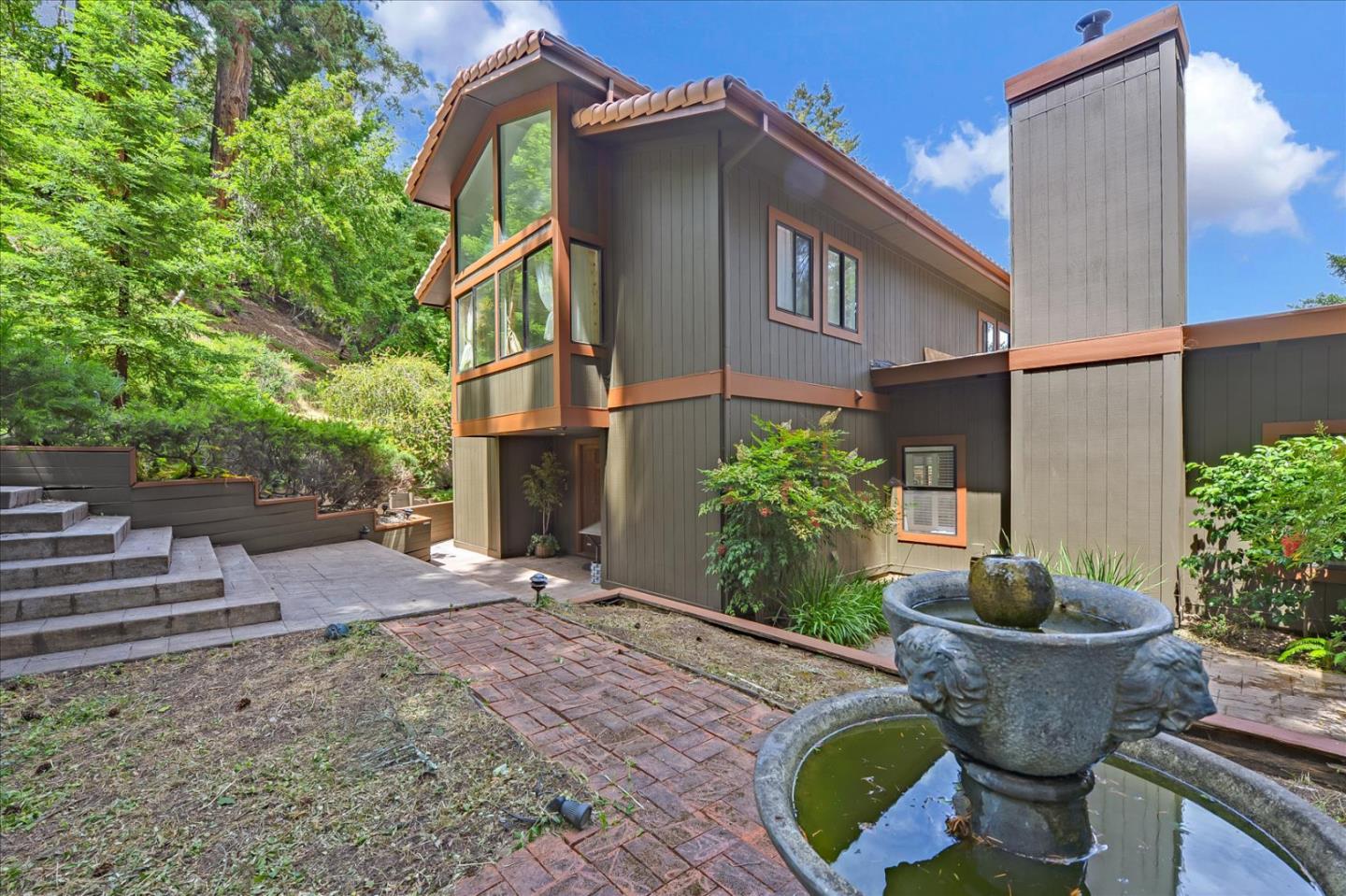 35 Echo Lane Woodside, CA 94062 - Photo 5 of 54 a backyard of house with outdoor seating and plants