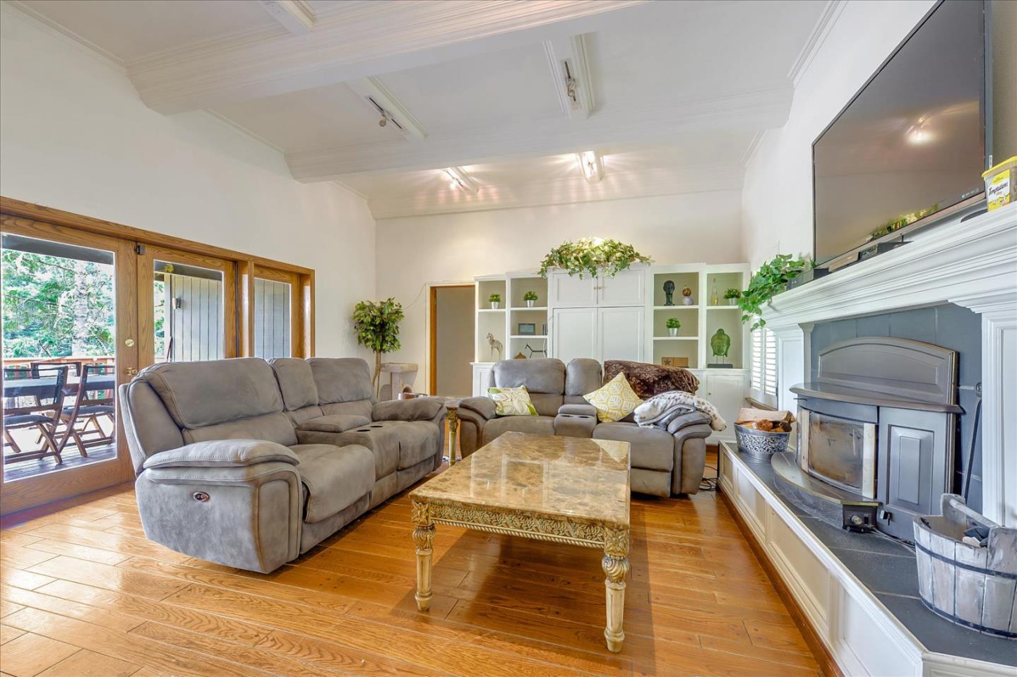 35 Echo Lane Woodside, CA 94062 - Photo 10 of 54 a living room with furniture a large window and a fireplace