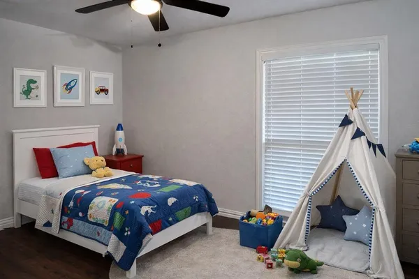a bedroom with a bed and a window