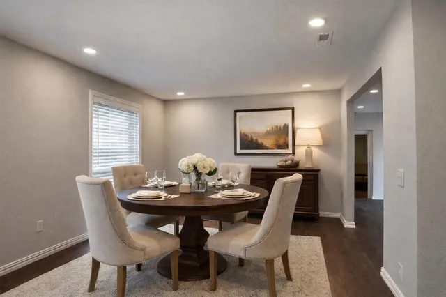a dining room with furniture and window