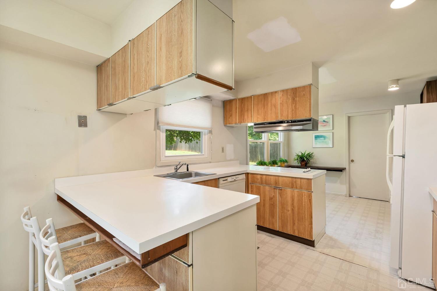 117 Drake Road Somerset, NJ 08873 - Photo 14 of 42 a kitchen with a stove a refrigerator and a sink