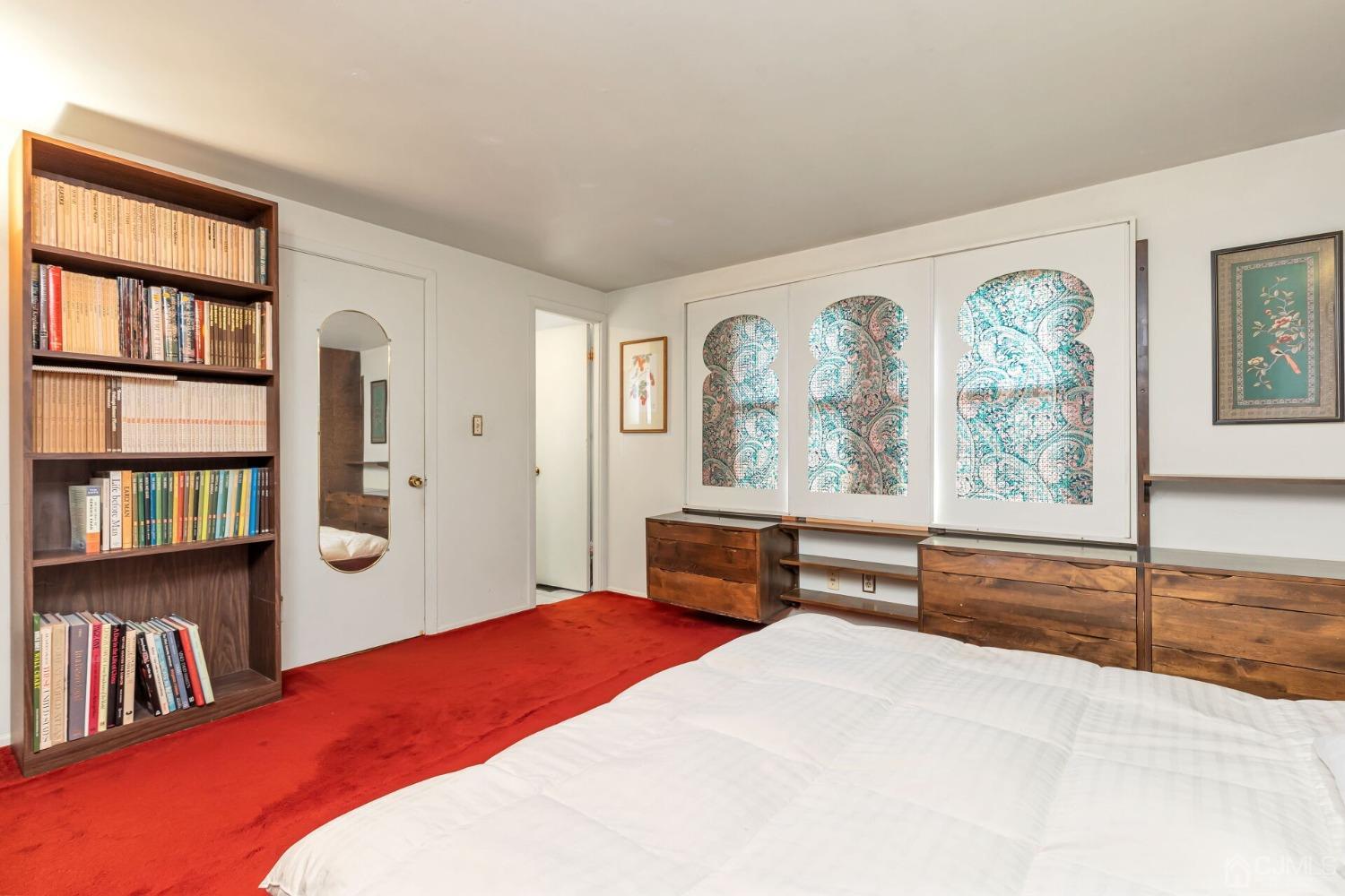 117 Drake Road Somerset, NJ 08873 - Photo 24 of 42 a bedroom with a bed large window and book shelf
