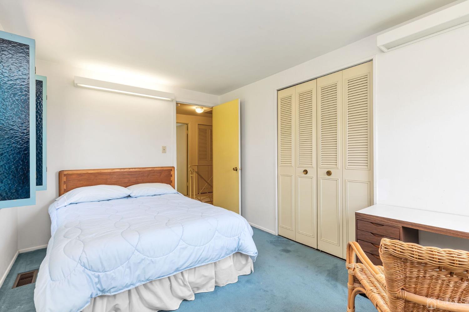117 Drake Road Somerset, NJ 08873 - Photo 27 of 42 a bedroom with a bed and wooden floor