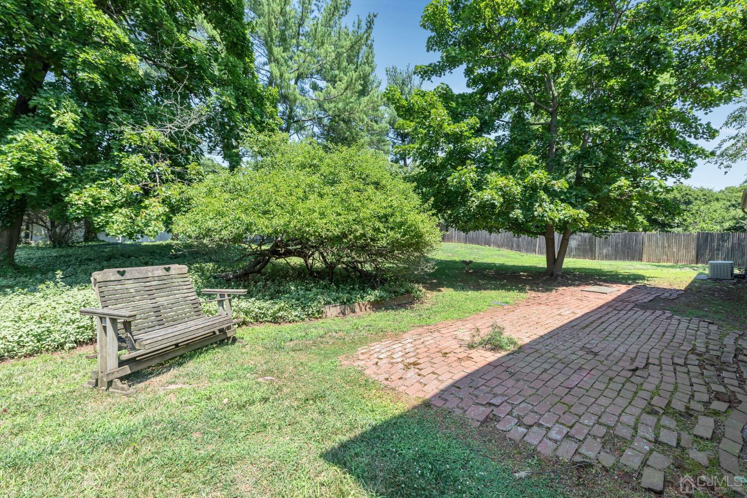 117 Drake Road Somerset, NJ 08873 - Photo 35 of 42 a park view with a bench and trees
