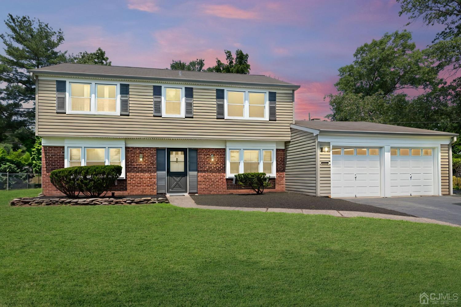 117 Drake Road Somerset, NJ 08873 - Photo 41 of 42 a front view of a house with a yard and outdoor seating