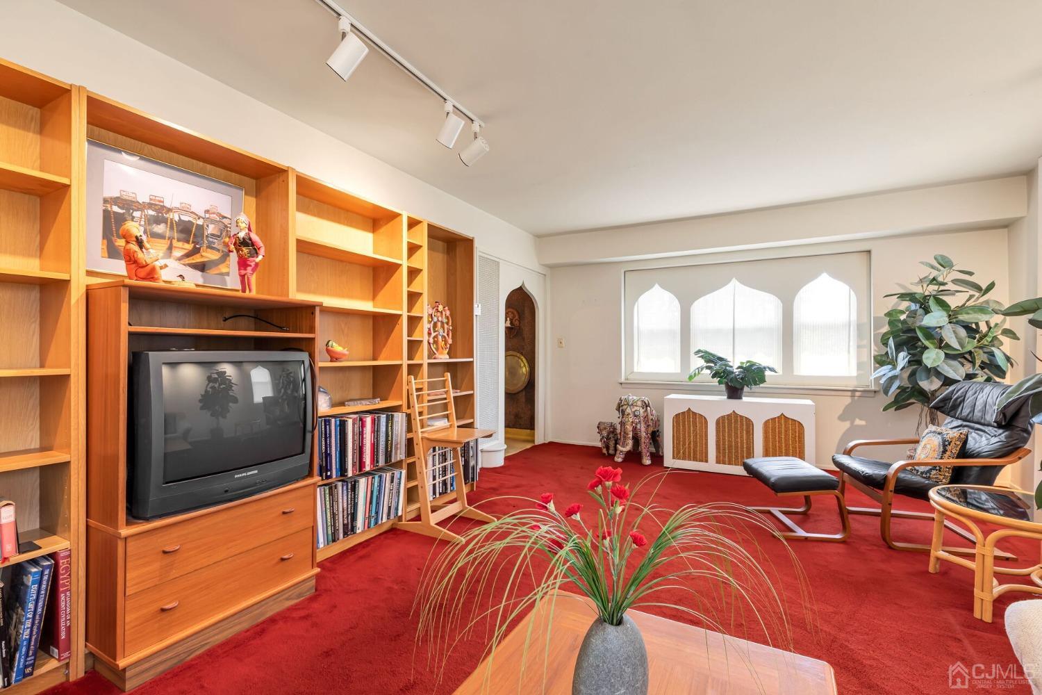 117 Drake Road Somerset, NJ 08873 - Photo 6 of 42 a bedroom with a bed and a flat screen tv