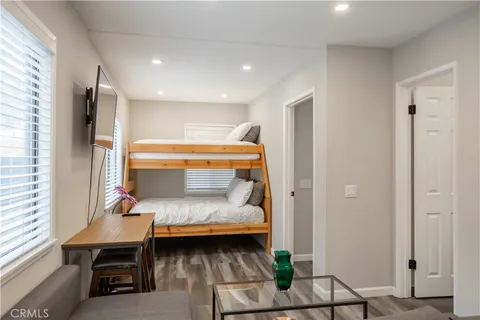 a bedroom with a bed and a table