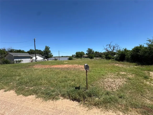 a view of a garden with a house