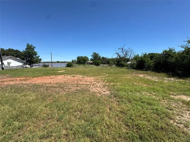 a view of a field with an ocean