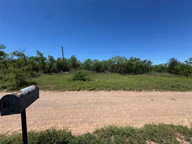 a view of a lake with a yard