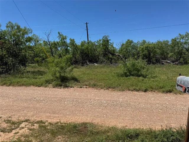 a view of a road with a park