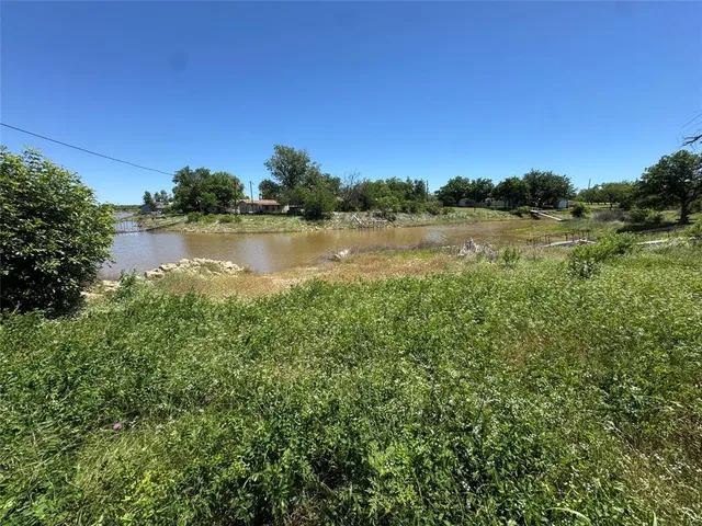 a view of lake with green space