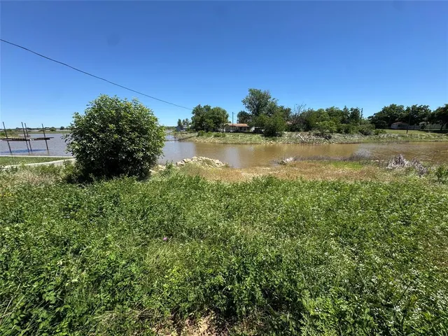a view of a lake from a yard