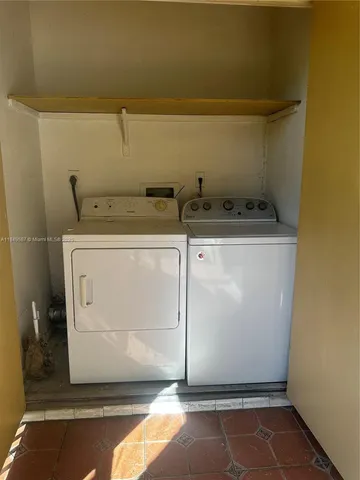 a utility room with washer and dryer