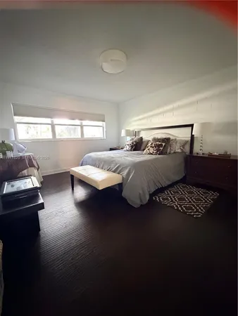 a bedroom with bed and window