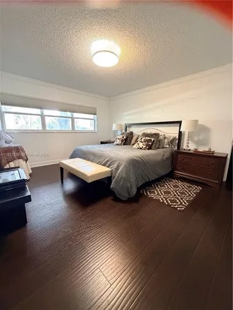 a bedroom with furniture and window