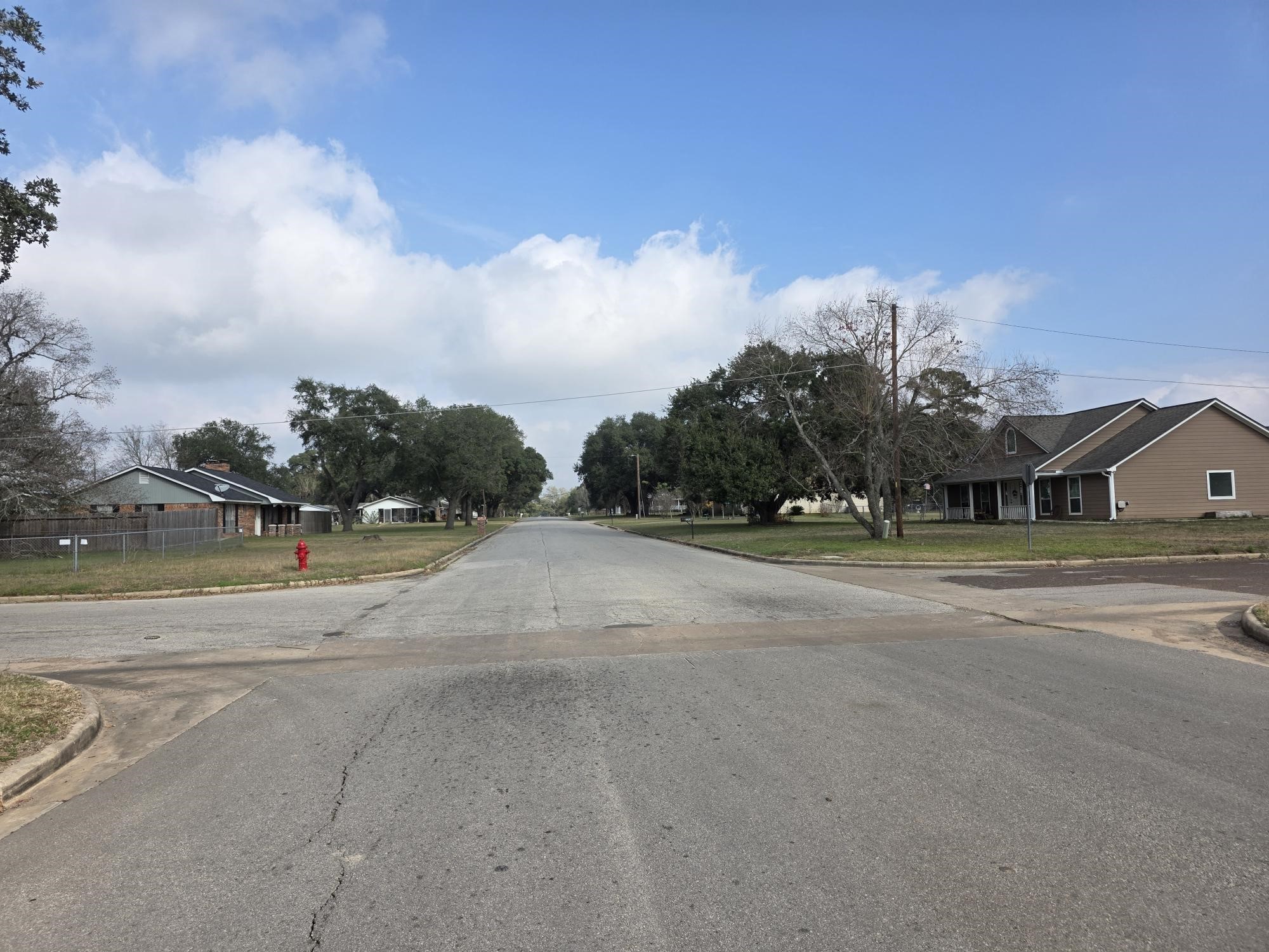 3 9th Street Hempstead, TX 77445 - Photo 2 of 11 a view of a town with big trees and a big yard