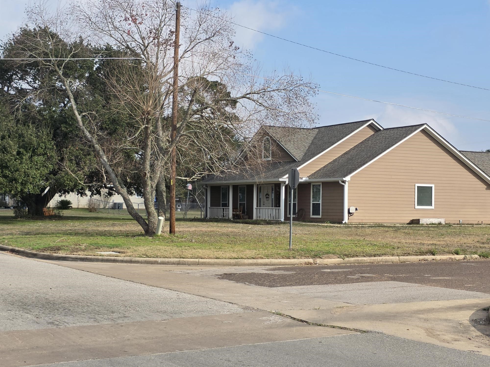 3 9th Street Hempstead, TX 77445 - Photo 6 of 11 a view of a house with a yard and large trees