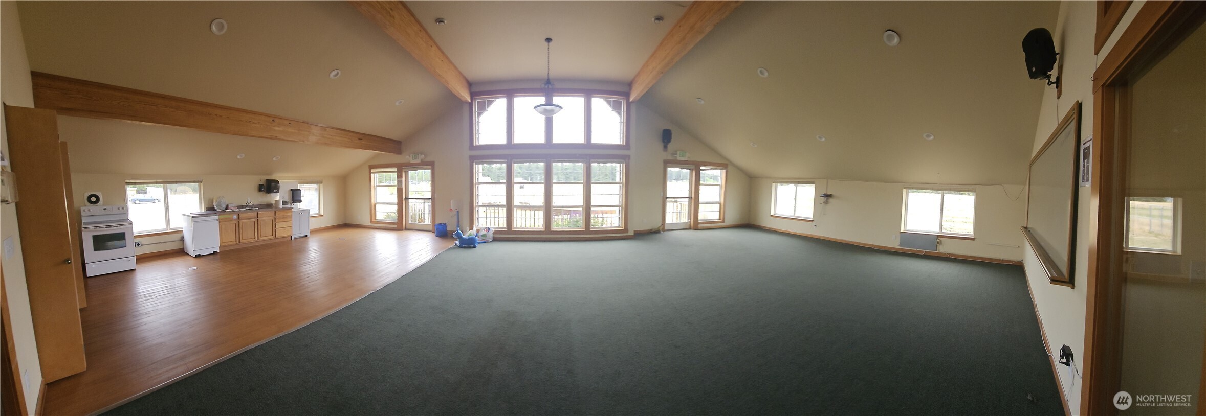 180 Parker Road Coupeville, WA 98239 - Photo 4 of 12 wooden floor in an empty room with a window