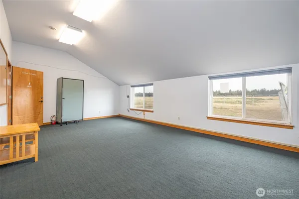 an empty room with windows and view