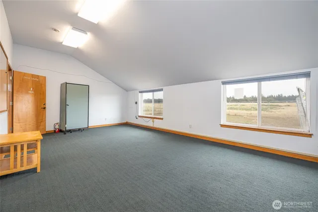 an empty room with windows and view