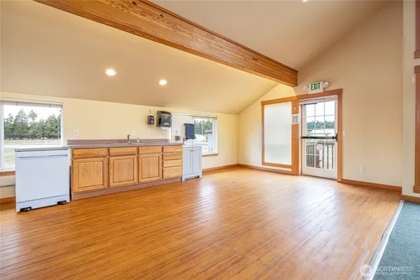 a view of a kitchen with a sink and a window