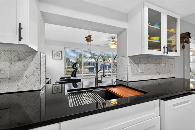 a living room with furniture and flat screen tv