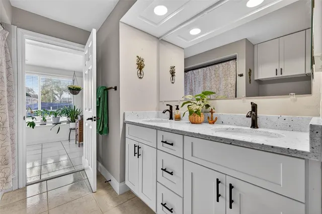 a kitchen with sink and cabinets